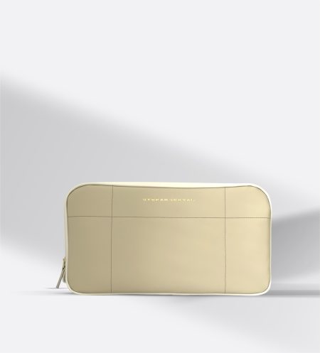 Luxury two-tone STEFAN SERVAL Entrata Superiore travel and toiletry bag handcrafted from premium cream and light beige Italian leather, showcasing a structured architectural silhouette.